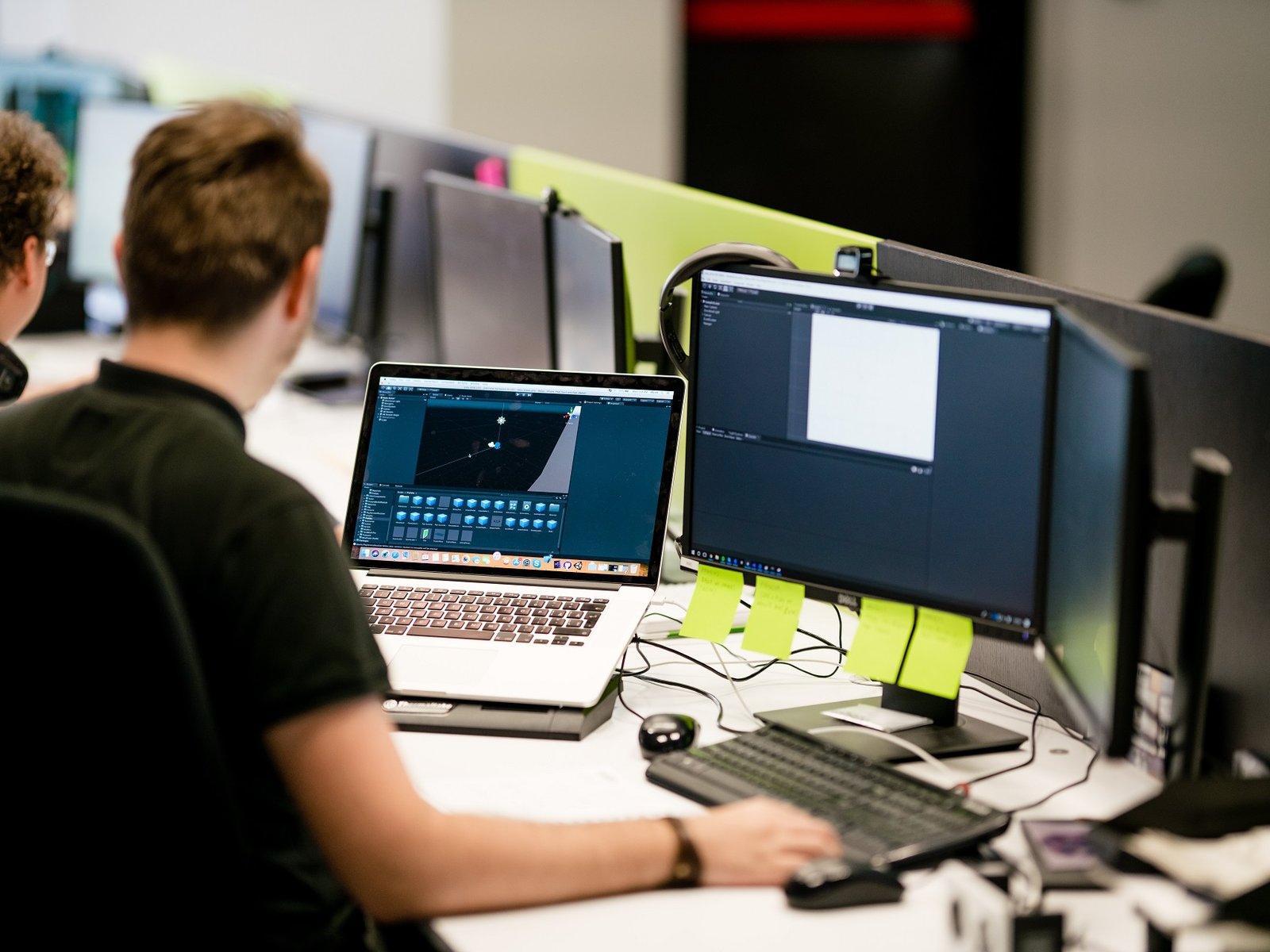 XR AR VR developers working on an application on the laptop