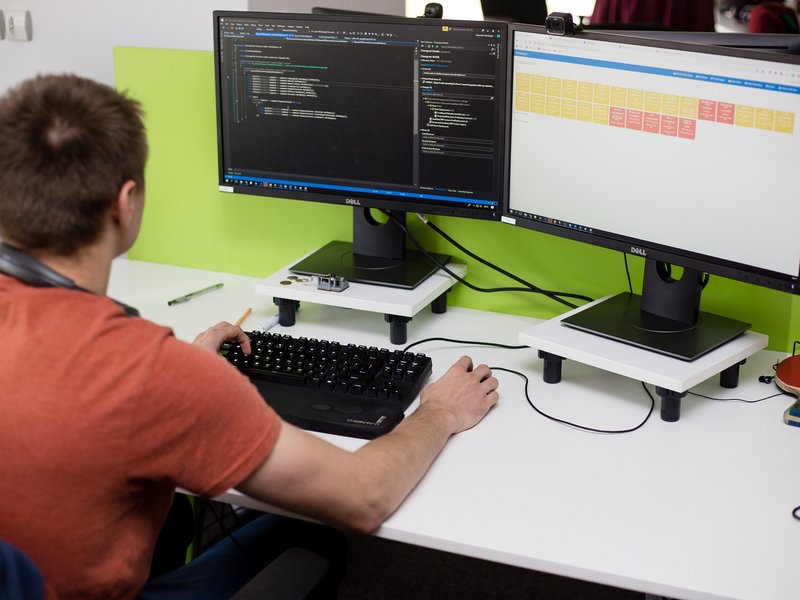 Full stack developer NET developer working at a computer