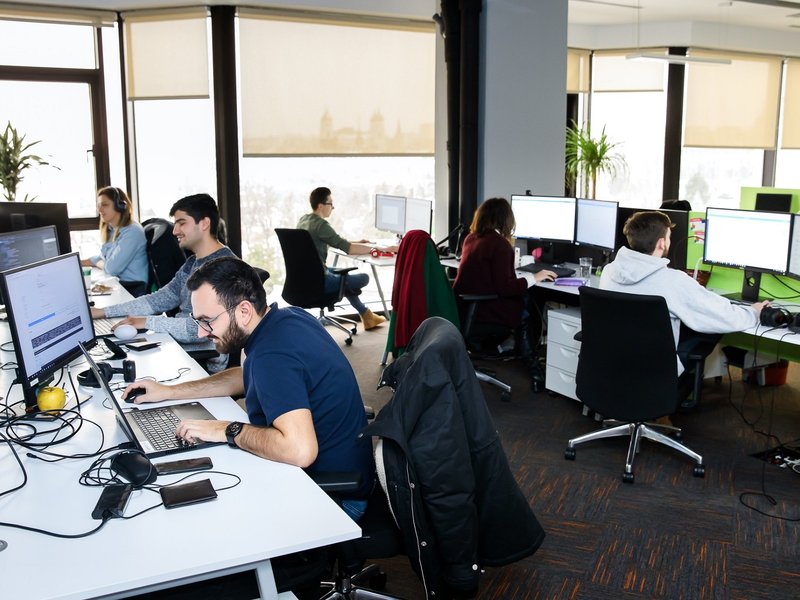 Centric Iasi Testers and developers working as a team on a project product